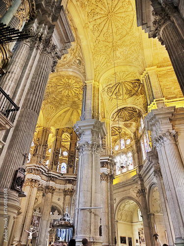 Interior of the Roman Catholic Malaga Cathedral (Basilica de la Encarnación). Renaissance architecture with enormous columns and Corinthian capitals on Aug 4, 2025. Malaga Andalusia, Spain, Europe.