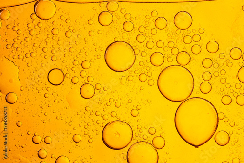Bild auf Leinwand Close-up yellow macro drink bubble texture,close up of glass with beer, yellow background, bubbles on the surface of the drink