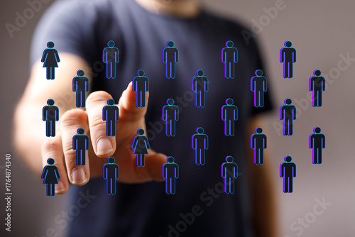 Фотография Hand reaching out to interact with human icons symbolizing teamwork, digital community, and collaboration