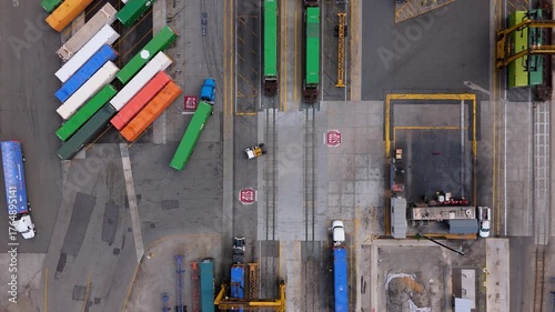 Aerial Top Down View of Freight Terminal with Trucks and Cargo Trains, October 7, 2025