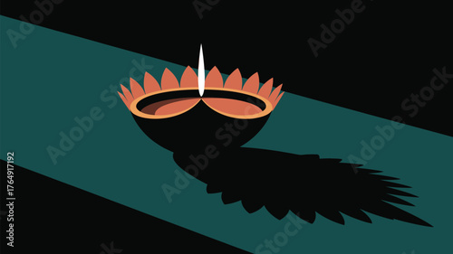 A diwali lamp with a flame casting a shadow on a teal surface against a black background space