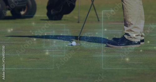 Golfer adjusting stance on green then swinging club, rolling ball toward hole for finishing putt