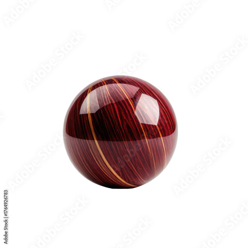 A glossy sphere with red and gold wood grain effect against black
