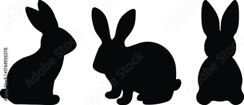 Set of black rabbit silhouettes in various sitting poses, minimal animal icons for nature, wildlife, Easter, and design themes