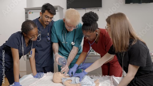 Diverse medical students learning infant CPR on a resuscitation dummy