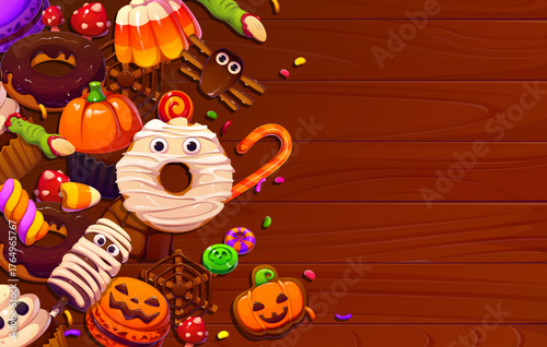 Halloween sweets and candies on vector wooden background with cupcake, lollipops, donuts and pumpkin cookies, candy corn, chocolate and gummy worms. Cartoon Halloween trick or treat party sweet food