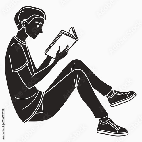 Silhouette of a man reading a book sitting