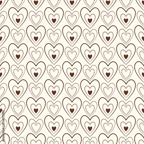 Sweet understated background. Seamless pattern of small brown hearts. Lots of tiny brown hearts on delicate beige background. A romantic delicate holiday decor