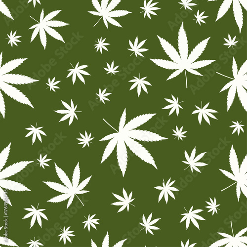 Seamless botanical pattern of white cannabis sativa leaves in various sizes scattered across a solid green background, a stylish vector graphic design