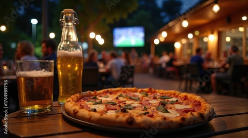 Fototapeta Naklejka Na Ścianę i Meble -  Pizza, beer and sports on TV at outdoor pizzeria at night. People gather on patio for food, drinks, and entertainment. Enjoy casual dining with friends. 