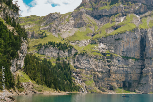 Lake Oeschinen with Waterfall and Mountains in Kandersteg Switzerland