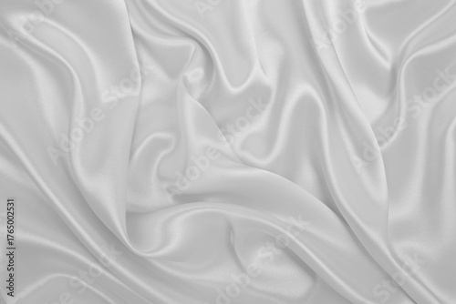 Smooth elegant white silk or satin luxury cloth texture as wedding background. Luxurious background design