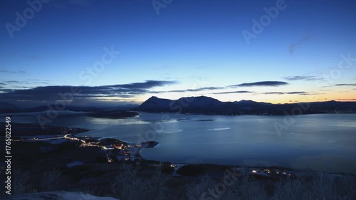 Timelapse captures a vivid Arctic sunset beyond Malangen fjord the Arctic Circle in Northern Norway