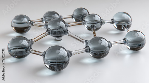 Frosted glass nodes and arrows form a directed acyclic graph on white acrylic board