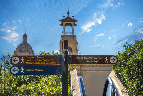 Street signs marking the direction to the few famous sites to visit in Barcelona, Spain