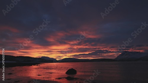 Timelapse captures a vivid Arctic sunset beyond Malangen fjord the Arctic Circle in Northern Norway