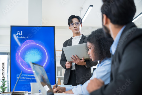 Multiethnic business and creative team collaborating meeting in modern office using AI assistant, big data, and digital tools for innovation and strategy.