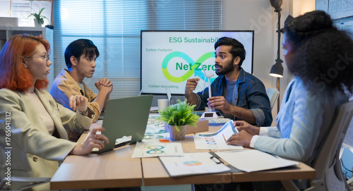 Diverse business team meeting in modern office to discuss sustainability, ESG goals, and eco-friendly strategies focused on green initiatives, environmental responsibility, and corporate ethics.