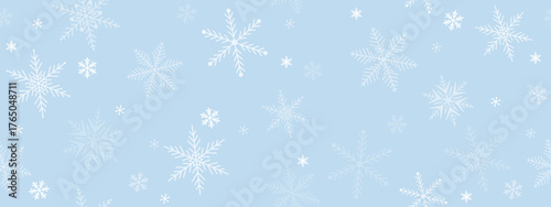 Christmas seamless background with white snowflakes on a delicate blue. It's snowing! New Year horizontal banner.  Snowfall greeting card. Vector illustration.