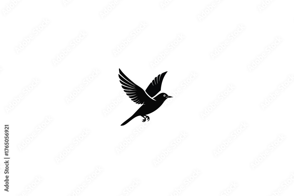 Obraz premium A simple black silhouette of a bird in mid flight against white