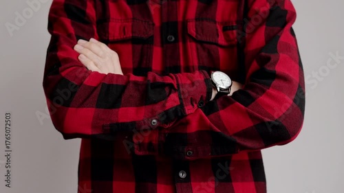 Checking time. Serious worried man looking at her watch waiting for something. Male look angry.