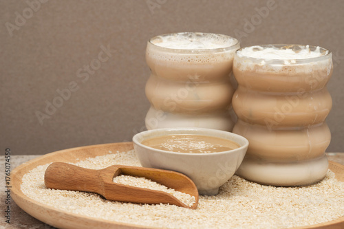 Tahini Latte. Coffee with sesame paste tahini in a cup on the Travertine table