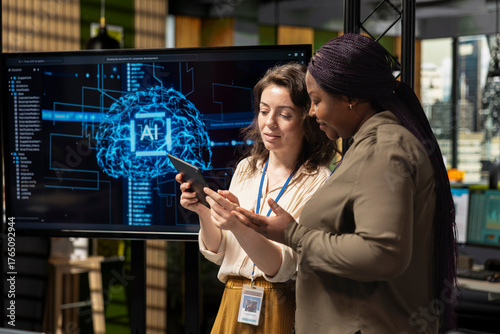 фотографія Diverse management staff reviewing advanced AI algorithms and predictive models to enhance organizational growth strategy, employee performance and long term company objectives
