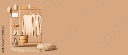 Wooden rack with stylish cl...