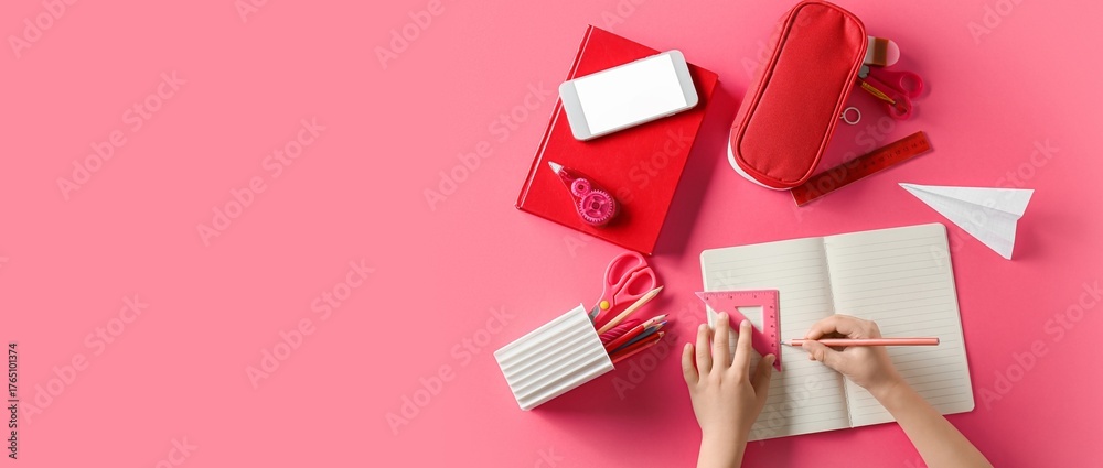 Obraz premium Hands with school stationery and mobile phone on pink background with space for text