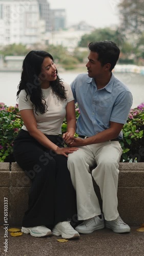 Romantic asian couple holding hands and talking
