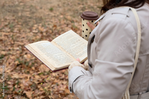 Woman with coffee reading b...