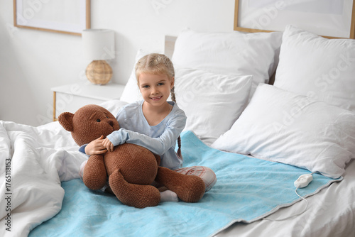 Cute little girl with toy b...
