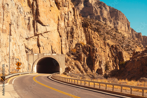 Buffalo Bill  Historic Dam Park & recreation is near. Drive thru mountain tunnels at Cody, Wyoming, USA. See mountain cliff formations in scenic areas of the state