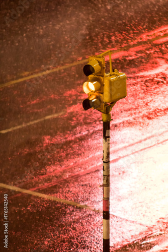 Fotografie Vertical image of a semaphore with yellow light on