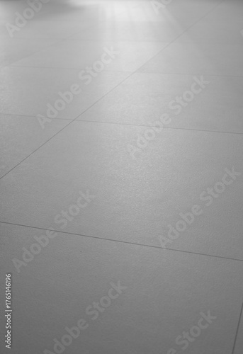 
The living room has a beige hardwood floor.