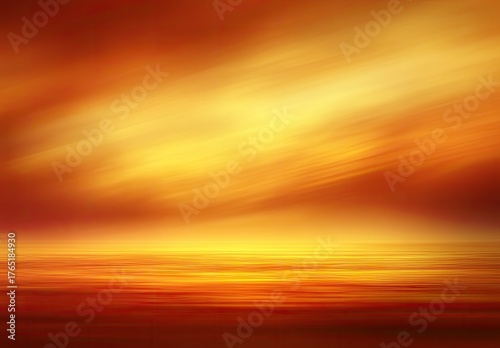 Blurred sunset/sunrise sky with glowing water reflection