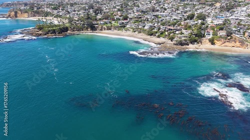 Wallpaper Mural Aerial view of Laguna Beach shoreline with ocean waves, kelp forests, and coastal homes nestled above the bluffs Torontodigital.ca