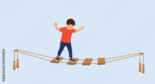 A young child bravely walks across a rope bridge balancing carefully.