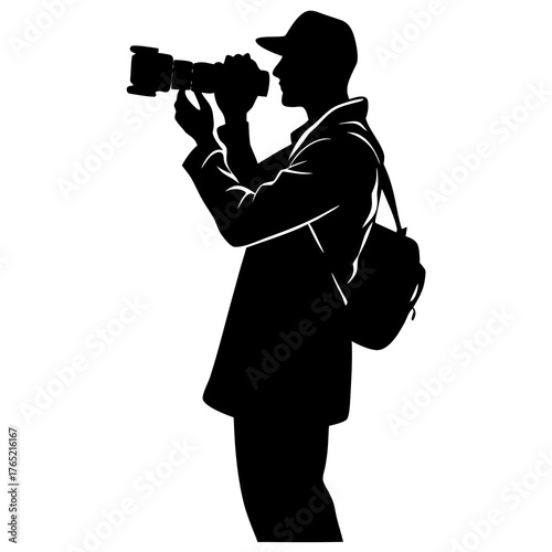 Silhouette of a photographer wearing a cap and carrying a camera bag taking a picture