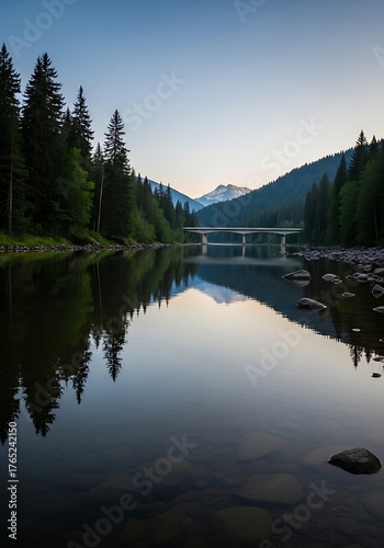 Still waters reflect the mountain vista and bridge serenity in nature