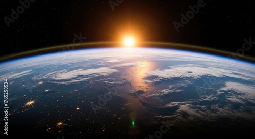 Fototapeta Naklejka Na Ścianę i Meble -  Bright sunrise over the horizon of planet Earth viewed from space