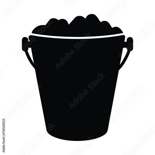 Black and white silhouette image of a bucket filled with material
