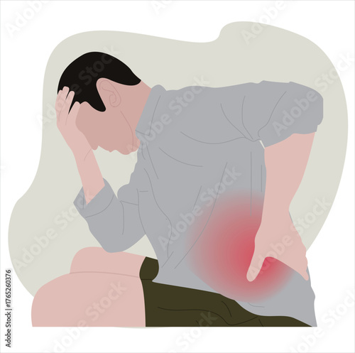 men with back pain.A handsome young man suffering from back 