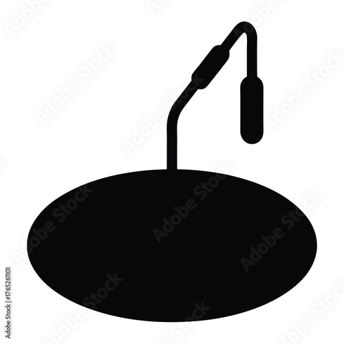 Abstract silhouette of a microphone on a stage base for performance