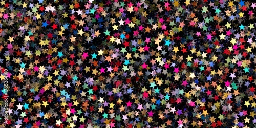 Colorful glitter stars creating festive abstract background texture