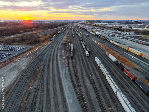 Aerial View of a Large Train Yard at Sunset
