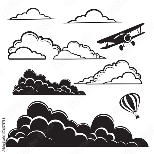 Black and white clouds biplane and hot air balloon