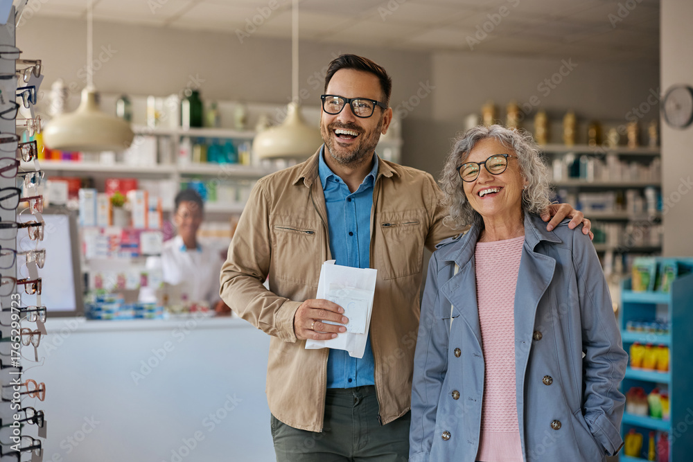 Fototapeta premium Satisfied man and his senior mother leaving pharmacy.