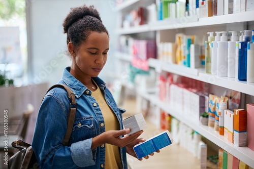 Obraz na plátně African American woman buying skin care products in pharmacy store