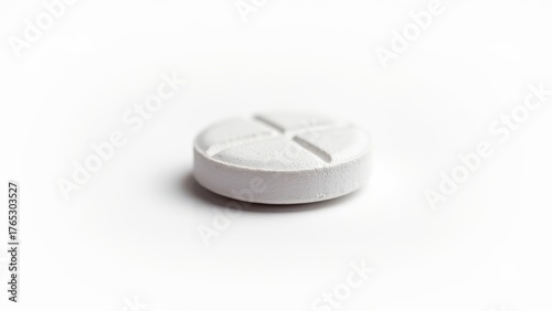 aspirin tablet closeup isolated on white background showing medical drug used as nsaid and antiplatelet agent for pain relief fever and inflammation concept of medicine, healthcare